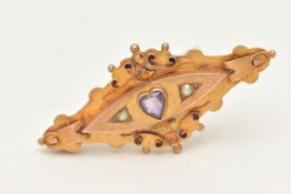AN EARLY 20TH CENTURY 9CT GOLD SWEETHEART BROOCH, lozenge shape set with a heart cut amethyst and