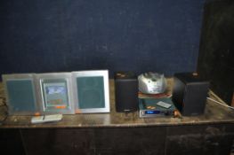 A BRENNAN JB7 HI FI AND BSP50 SPEAKERS WITH REMOTE along with a Nakamichi SoundSpace 5 with matching