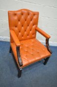 A REPRODUCTION BLOOD ORANGE LEATHER BUTTONED GAINSBOROUGH ARMCHAIR, 72cm squared x height 100cm,