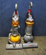A DYSON SMALL BALL UPRIGHT VACUUM CLEANER and a Dyson DC24 All Floor upright vacuum cleaner (brush
