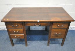 A 20TH CENTURY OAK KNEEHOLE DESK, fitted with six assorted drawers, width 138cm x depth 77cm x