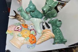 A GROUP OF SYLVAC AND BESWICK ORNAMENTS AND WALL POCKETS, comprising a fireside green terrier