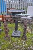 AN EARLY 20th CENTURY CAST IRON URN ON COLUMNED STAND, height 82cm, along with a pair of cast iron