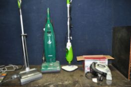 A COLLECTION OF THREE VACUUM CLEANERS AND A STEAM MOP including a Hoover Pure Power, a G Tech Air