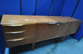 A MID-CENTURY MCINTOSH SIDEBOARD, with a fall front cupboard door, enclosing a black vinyl cutting