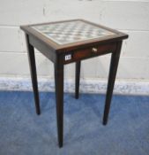 AN EDWARDIAN SQUARE MAHOGANY GAMES TABLE, with a chess table top, and two drawers, containing a