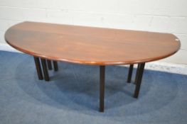 A REPRODUCTION MAHOGANY GATE LEG WAKE TABLE, that opens to an oval, on eight reeded legs, length