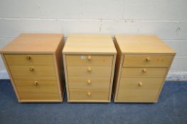 A SET OF THREE MODERN BEECH FILING CABINETS, one with four drawers, two with three drawers (3)