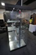 A GLASS DISPLAY CABINET, with four shelves, and a five circular revolving shelves, width 91cm x