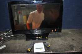 A LG 32LH5000 32in TV WITH REMOTE along with a Philips DVD player with remote and manual (5)