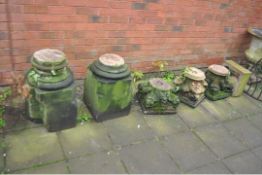 A COLLECTION OF SANDSTONE ARCHITECTURAL COLUMN PARTS including two bases and three tops with