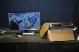 A SAMSUNG T32E310EX 32in TV WITH REMOTE, a Digilogik DVD player with remote (both PAT pass and