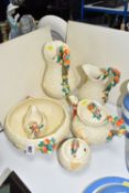 A GROUP OF CLARICE CLIFF 'CELTIC HARVEST' POTTERY, comprising, two jugs height 28cm and 22cm, a