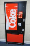 A LARGE ELECTRIC COCA-COLA ADVERTISING SIGN, mimicking the front of a vending machine, on castors,