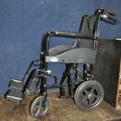 A DRIVE MEDICAL EXPEDITION FOLDING WHEELCHAIR with two footrests