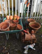 A COLLECTION OF VINTAGE AND MODERN TERRACOTTA PLANT POTS, the largest being 45cm in diameter, a