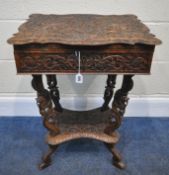 A 20TH CENTURY INDIAN OAK SEWING TABLE, with intricate carved details, the top depicting two birds