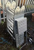 AN ALUMINIUM FOLDING PLATFORM LADDER, with three loose platforms