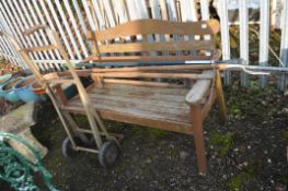 A MODERN HARDWOOD GARDEN BENCH, with slatted seat and back, width 127cm, along with four gardening