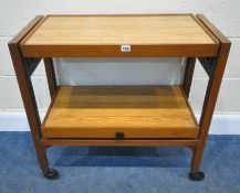 A MID CENTURY TEAK TWO TIER METAMORPHIC TROLLEY, with Flexello castors, width 78cm x depth 38cm x