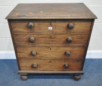 A 19TH CENTURY MAHOGANY CHEST OF FOUR DRAWERS, raised on turned feet, width 79cm x depth 48cm x