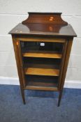 AN EARLY 20TH CENTURY MAHOGANY CABINET, with a raised back, a single glass door, raised on square