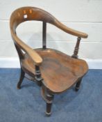 A 19TH CENTURY WALNUT ARMCHAIR, with a deep dished seat, swept open armrests, raised on turned and