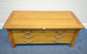 A MODERN OAK COFFEE TABLE, fitted with two short over two long drawers, width 119cm x depth 57cm x