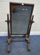 AN EARLY 19TH CENTURY MAHOGANY FLOOR STANDING MIRROR, with a rectangular bevelled mirror plate,