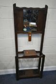 A 20TH CENTURY OAK HALL STAND, with four hooks, a central mirror, a hinged storage compartment,