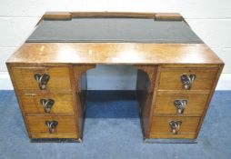 LIBERTY AND CO OF LONDON, AN ARTS AND CRAFTS OAK DRESSING CHEST, with a black glass surface,