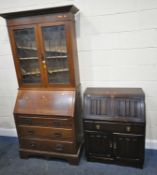 A 20TH CENTURY OAK BUREAU BOOKCASE, with double lead glazed doors, atop a base with a fall front