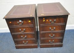 A PAIR OF 20TH CENTURY MAHOGANY TWO DRAWER FILING CABINETS, each with a purple leather writing