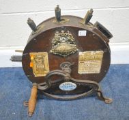 A KENTS OAK CASED KNIFE CLEANER, 199 High Holborn, London with a brass and a ceramic plaque, a