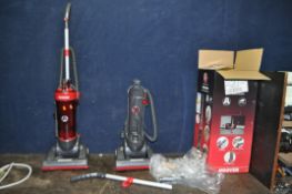 A HOOVER WHIRLWIND UPRIGHT VACUUM CLEANER and a boxed and new Hoover Whirlwind vacuum chassis (no