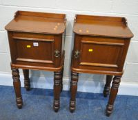 AN OPPOSING PAIR OF VICTORIAN MAHOGANY BEDSIDE CABINETS, with raised back and sides, the single door