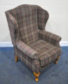 A MODERN TARTAN UPHOLSTERED WING BACK ARMCHAIR, width 79cm x depth 83cm x height 114cm, condition