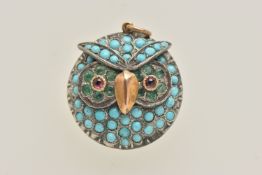 A TURQUOISE SET OWL PENDANT, circular owl face pendant, set throughout with turquoise cabochons,