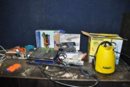 A CHAMPION PRESSURE WASHER, a Performance Power angle grinder, a Supatool Sander, a Torque-Master