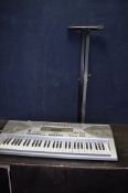 A CASIO CTK-900 ELECTRONIC KEYBOARD with footswitch and stand (NO POWER SUPPLY SO UNTESTED)