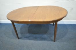 G PLAN, A MID CENTURY TEAK OVAL EXTENDING DINING TABLE, with a single fold out leaf, raised on