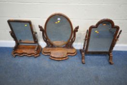 A VICTORIAN MAHOGANY DRESSING MIRROR, with scrolled and foliate supports, and a lid to the base,