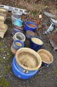 EIGHTEEN GLAZED GARDEN PLANT POTS, including two large blue pots 51cm in diameter, a pair of blue