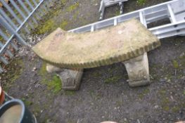 A MODERN CONCRETE CURVED GARDEN BENCH with detailed bases, length 125cm. Condition Report: no