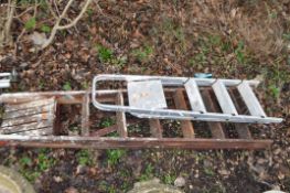 A MID CENTURY WOODEN STEP LADDER, height 195cm, and an aluminium step ladder (2). Condition