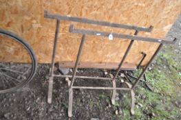 A PAIR OF VICTORIAN CAST IRON HURDLE TRESTLES, width 78cm height 75cm. Condition Report: both have