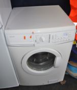 A JOHN LEWIS JLWM1203 WASHING MACHINE, width 60cm, depth 60cm, height 85cm (PAT pass, spin cycle run