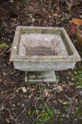 A MODERN CONCRETE GARDEN URN, constructed in two pieces with foliate detail to rim of a square