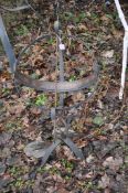AN ARCHIMEDEAN SUN DIAL with wrought iron frame and sphere and copper dial strip. Condition