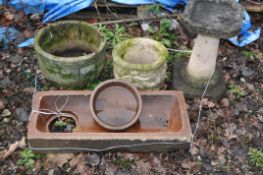 A TREACLE GLAZED WATER TROUGH AND THREE CONCRETE POTS AND BIRD BATH, trough width 68cm, depth